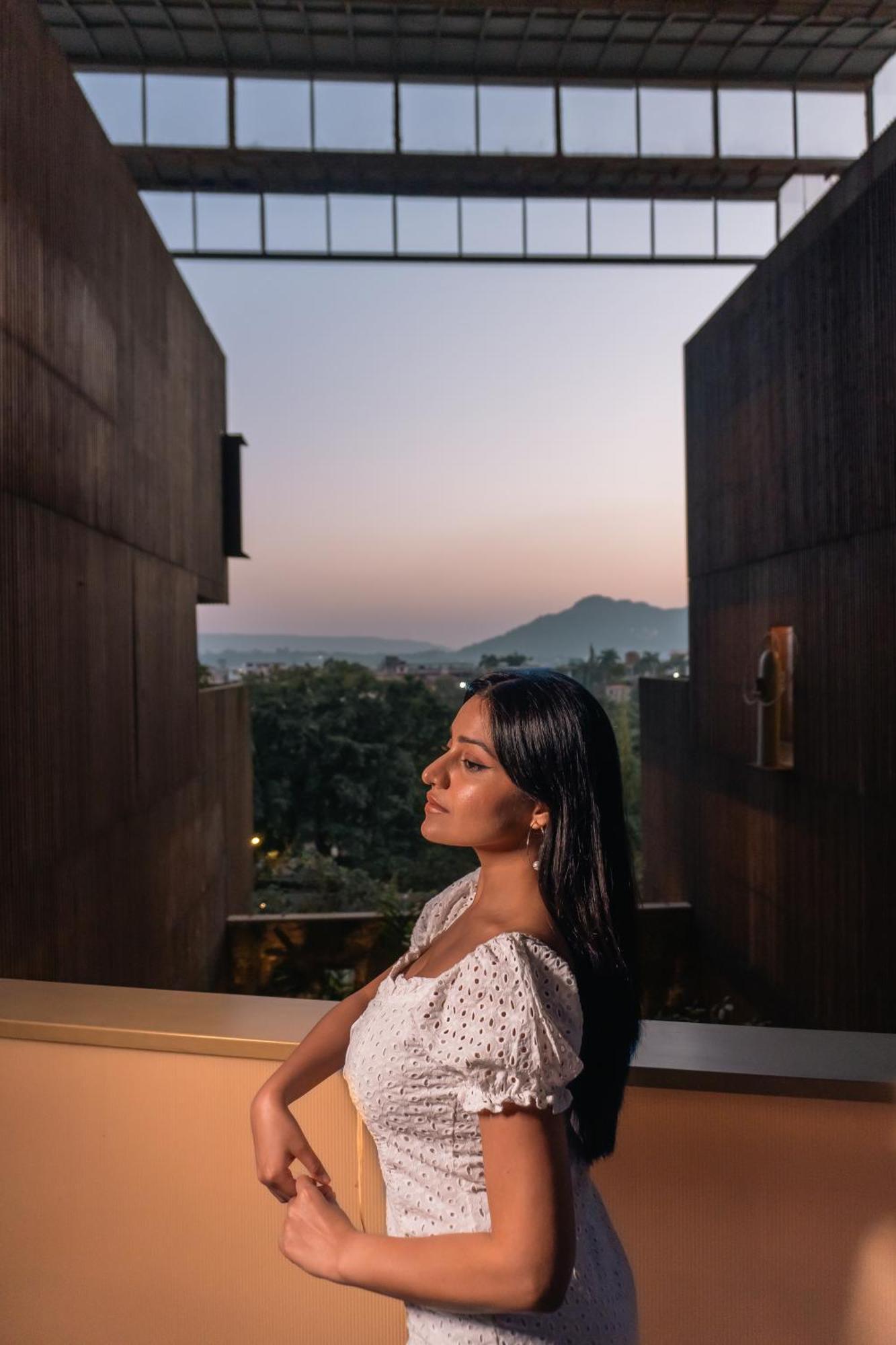 Radisson Resort And Spa Lonavala Kültér fotó A woman in contemplation